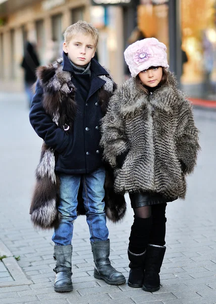 Portrait of a girl and boy in autumn — Stock Photo, Image