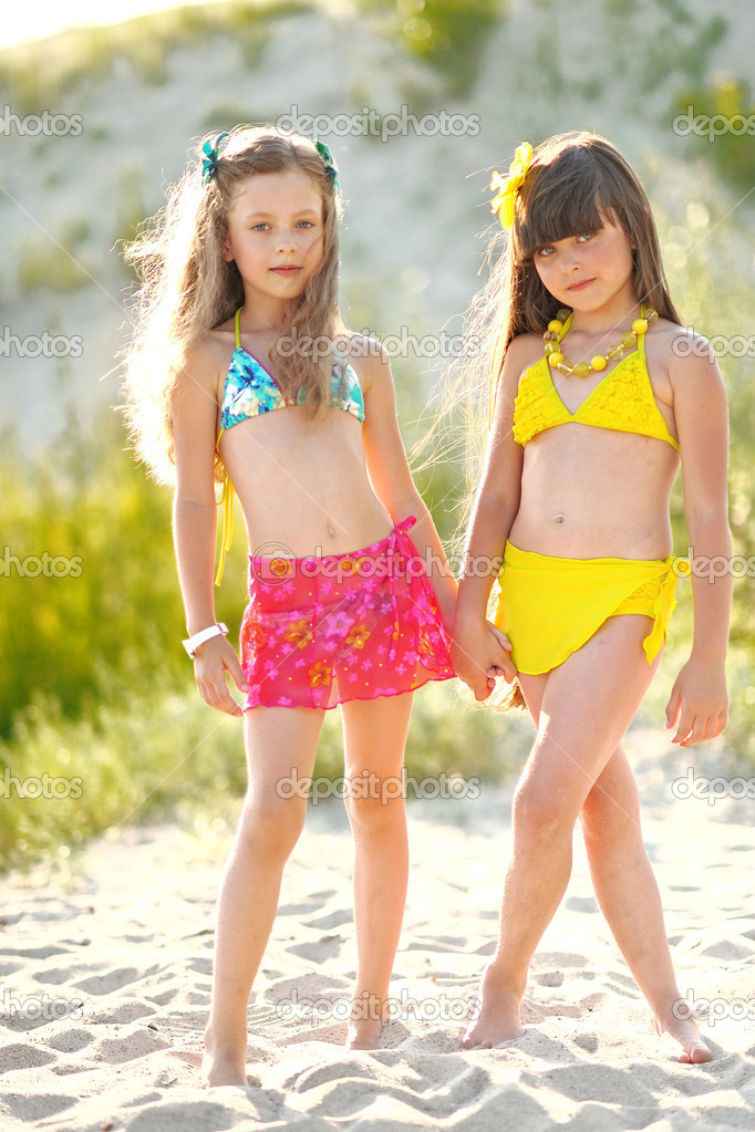 Portrait of children on the beach in summer