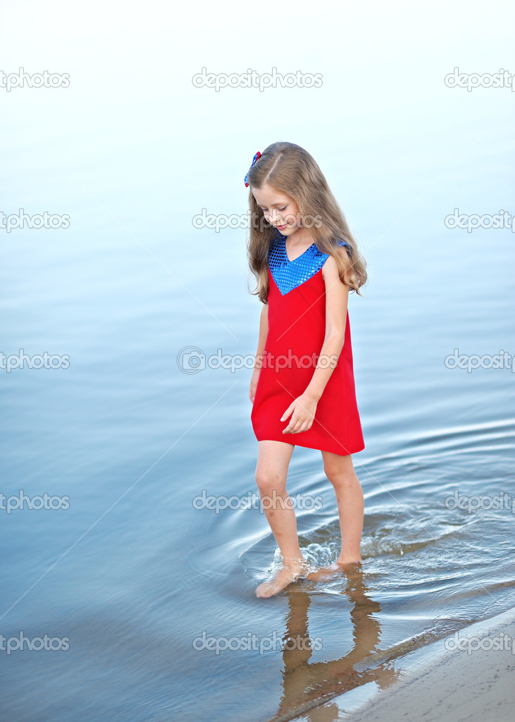 portrait of little girl on a summer beach