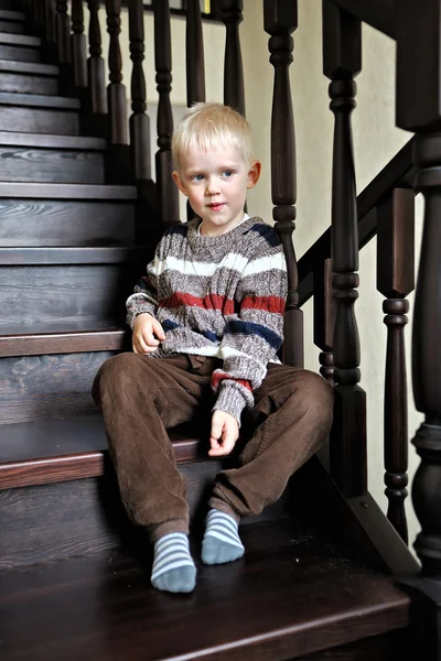 Portrait of a little boy in a sweater at home — Stock Photo, Image