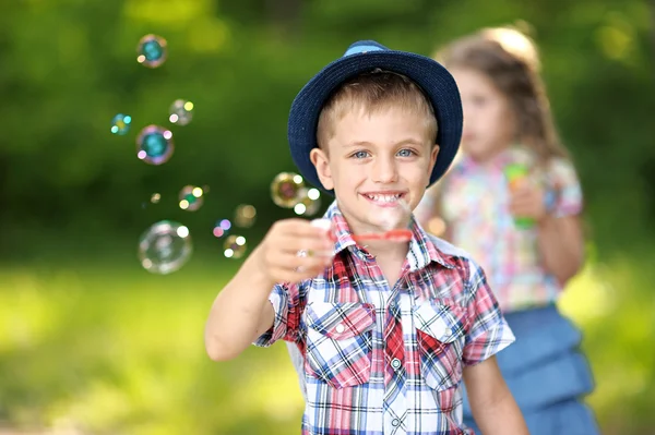 Portrait of a boy and girl in summer — Stock Photo, Image