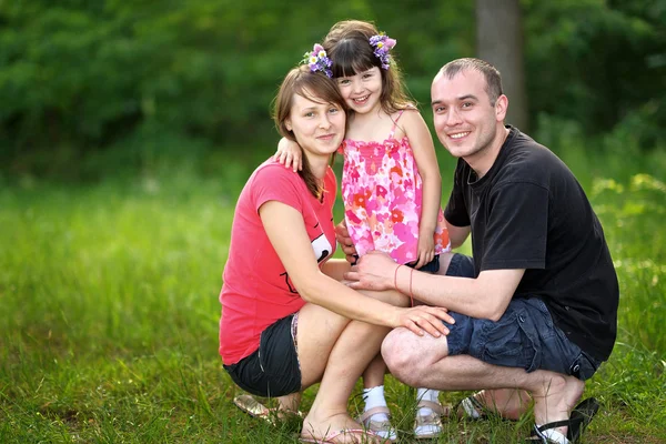 Portrait of a happy family in summer nature — Stock Photo, Image