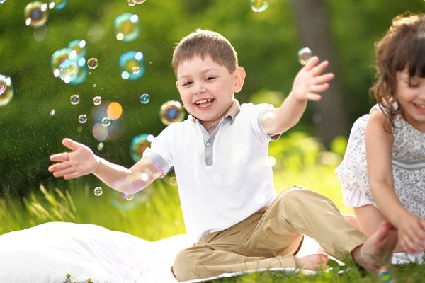 Portrait of a boy and girl in summer — Stock Photo, Image