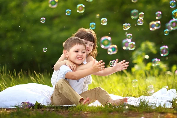 Portrait of a boy and girl in summer — Stock Photo, Image