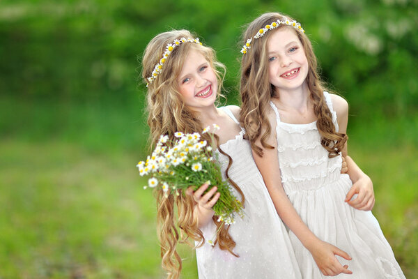Portrait of two girls in the woods girlfriends