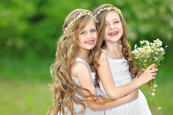 Portrait of two girls in the woods girlfriends