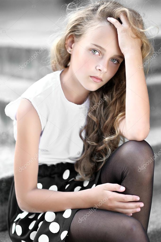 portrait of little girl outdoors in summer