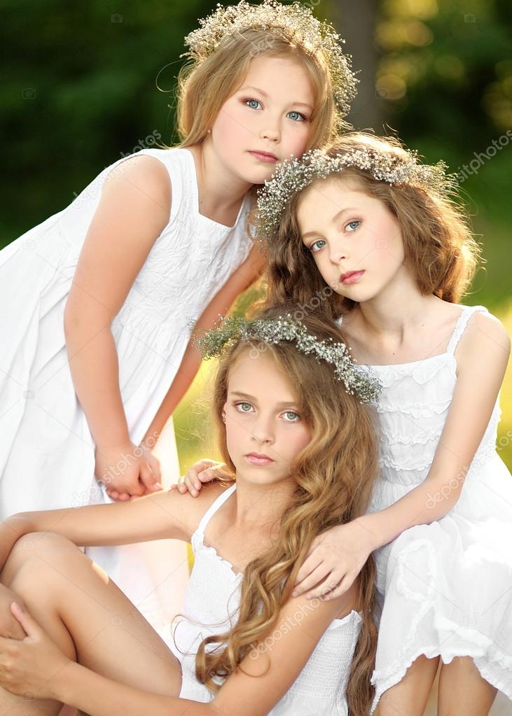 Portrait of two young girlfriends with flowers â Stock Photo Â© zagorodnaya #50468083