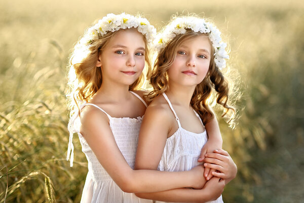 Portrait of two little girls twins