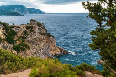 Mountains and forestry hills surround resort on Corfu island