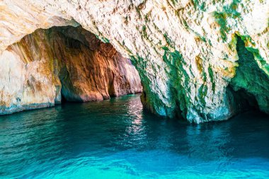 White-stoned rocks creating cave in Corfu island sea beach