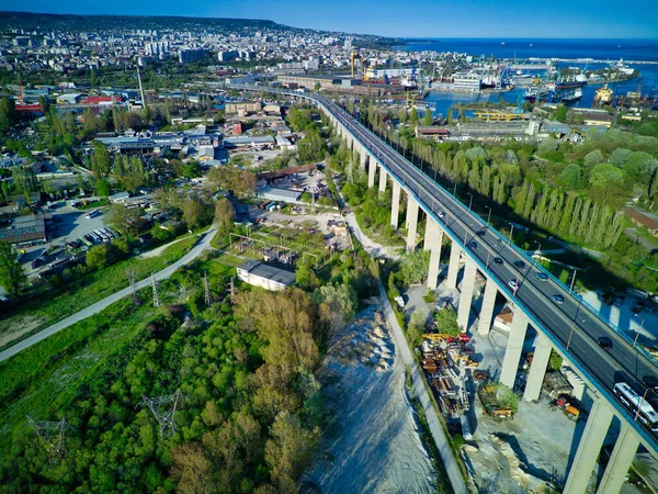 Bird\'s eye view of the modern historic small town of Sozopol with a variety of cozy seaside houses and small sea spring boats, near the calm deep rippled Black Sea