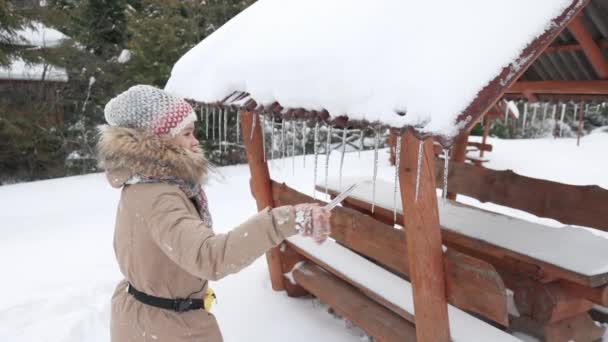 Side View Young Caucasian Girl Brown Coat Reaching Icicles Arbour — Stockvideo