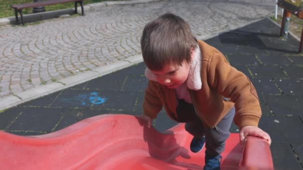 Cheerful Funny Little Boy Blue Hat Warm Clothes Plays Playground — Wideo stockowe