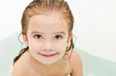 Cute small girl is taking a bath clipart