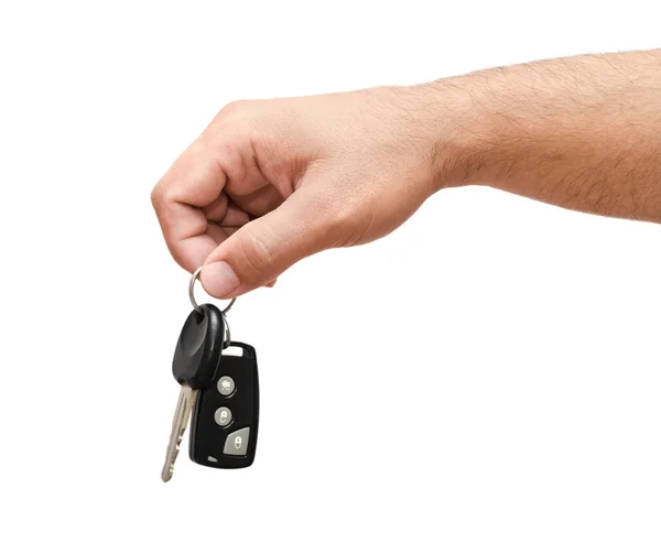 Mano masculina sosteniendo una llave del coche — Foto de Stock