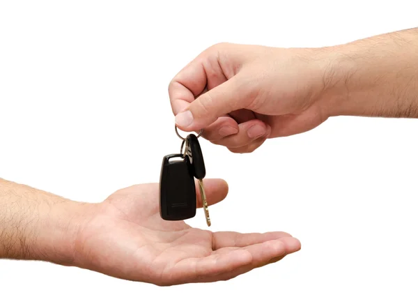 Mano masculina sosteniendo una llave del coche y entregándola a otro perso —  Fotos de Stock