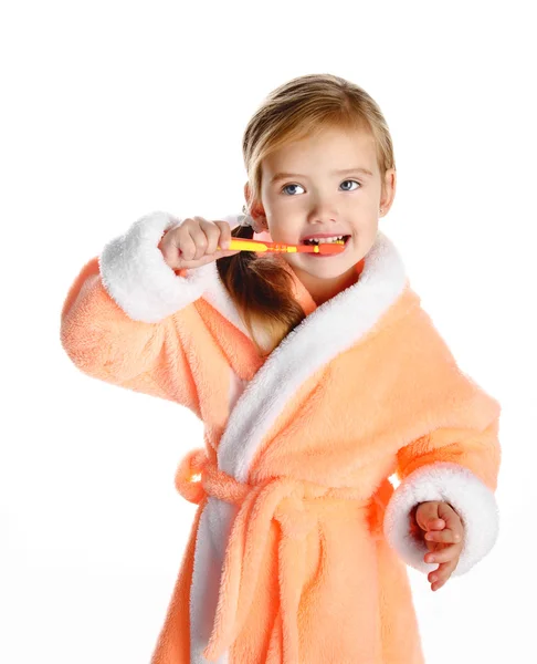 Little girl in dressing gown brushing her teeth isolated — Stock Photo, Image