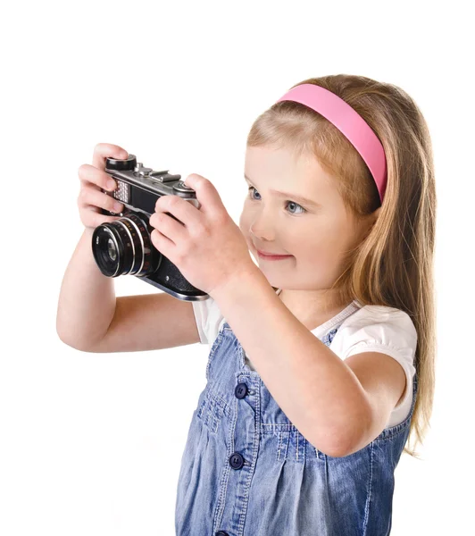 Sorrindo menina com câmera velha isolada — Fotografia de Stock