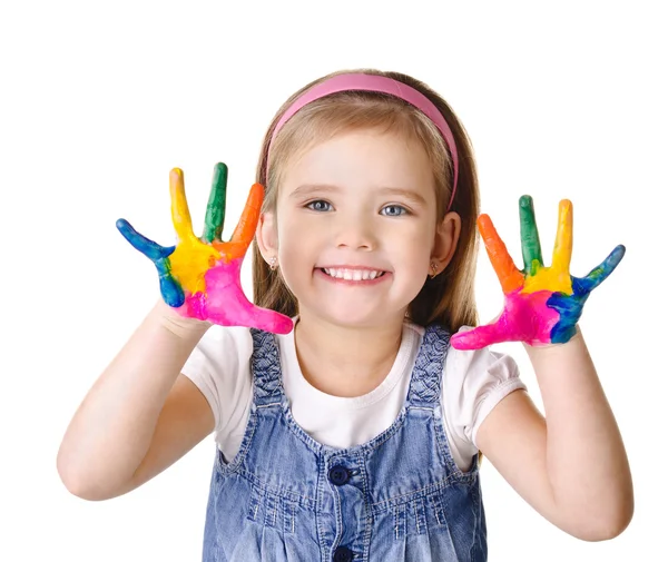 Lachende meisje met handen in de verf geïsoleerd op wit — Stockfoto