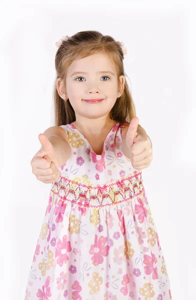 Милая маленькая девочка держит большие пальцы в изоляции — стоковое фото