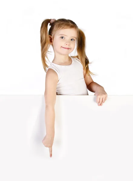 Smiling cute little girl showing finger — Stock Photo, Image