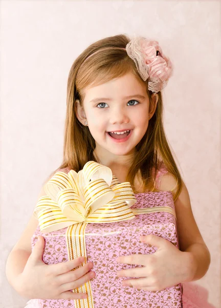 Portrait of little girl with gift box — Stock Photo, Image