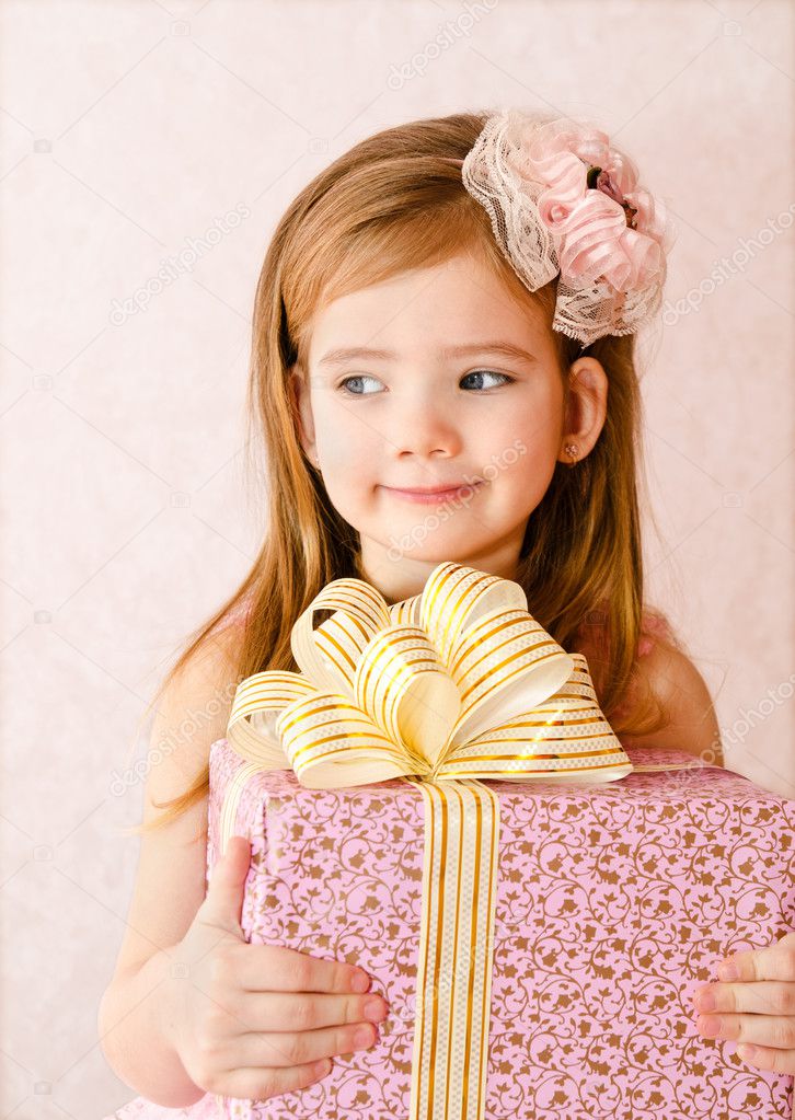 Portrait of little girl with gift box