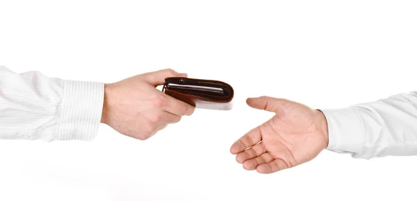 Male hand holding a wallet and handing it over to another person — Stock Photo, Image
