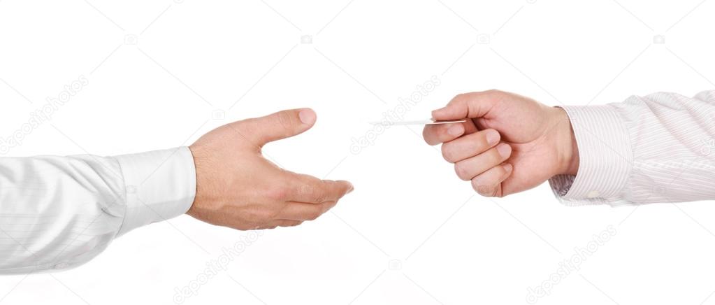 Male hand holding a credit card and handing it over to another p
