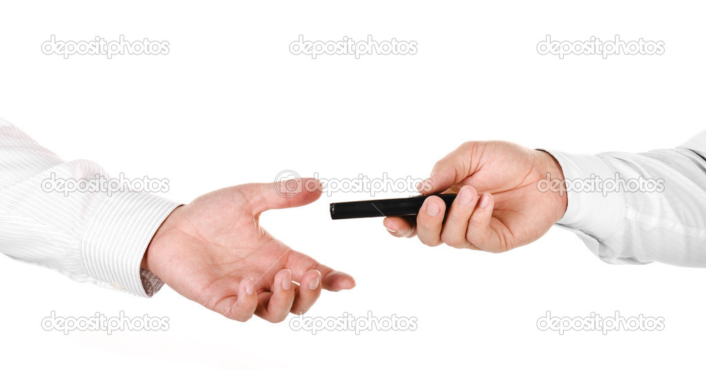 Male hand holding a mobile phone and handing it over to another