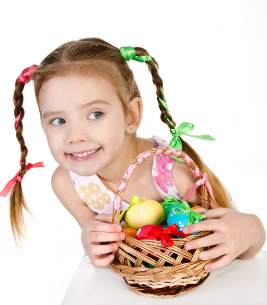 Smiling little girl with basket full of colorful easter eggs iso — Stock Photo, Image