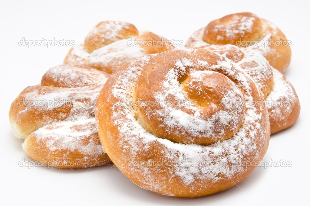 Group of delicious cinnamon rolls icing sugar isolated