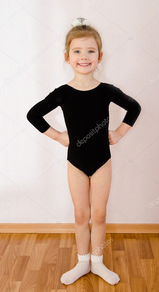 Gymnast cute little girl doing exercises