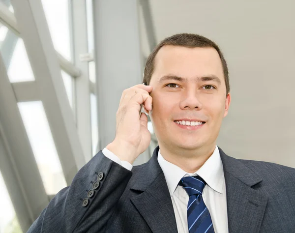 Portrait of young businessman calling by telephone — Stock Photo, Image