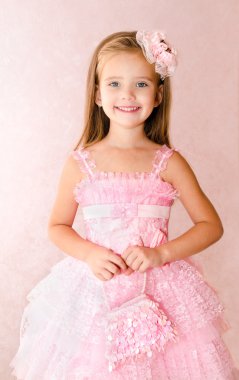 Portrait of adorable smiling little girl in princess dress