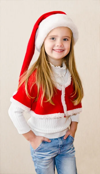 Happy smiling little girl in christmas hat — Stock Photo, Image