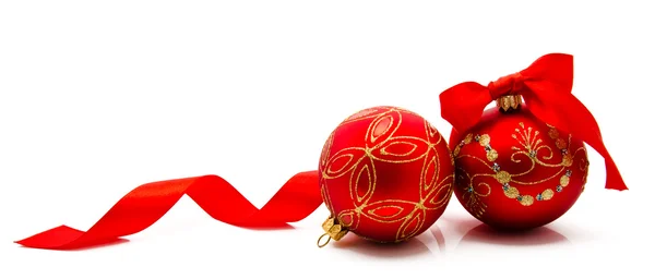 Two red christmas balls with ribbon isolated on a white — Stock Photo, Image