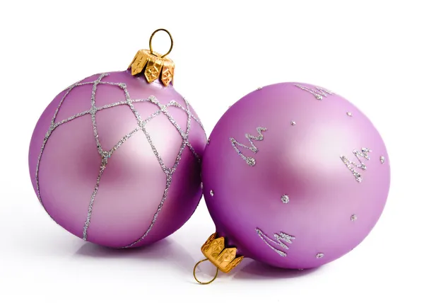 Two lilac christmas balls isolated on a white Royalty Free Stock Images