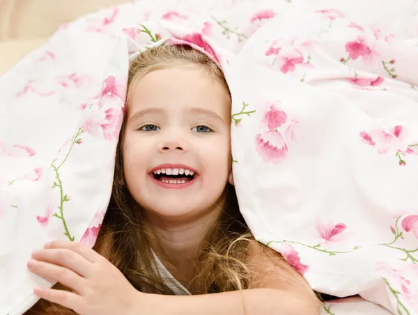 Adorable smiling little girl awaked up — Stock Photo, Image