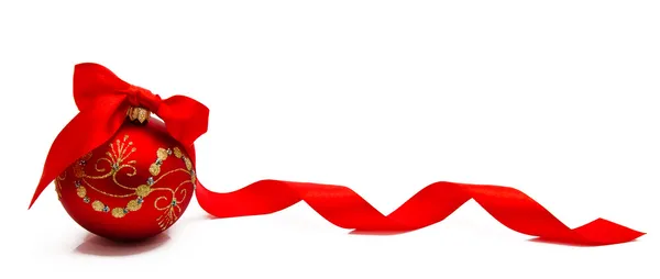 Red christmas ball with ribbon on a white background — Stock Photo, Image