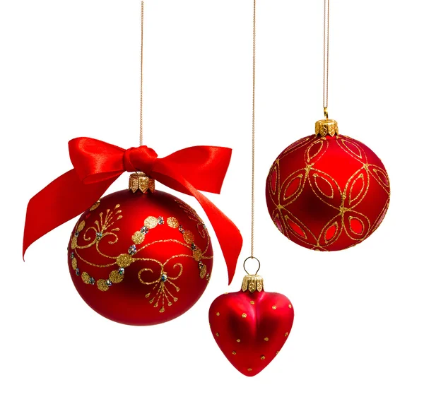 Red decorations Christmas ball hanging on ribbon Isolated. On