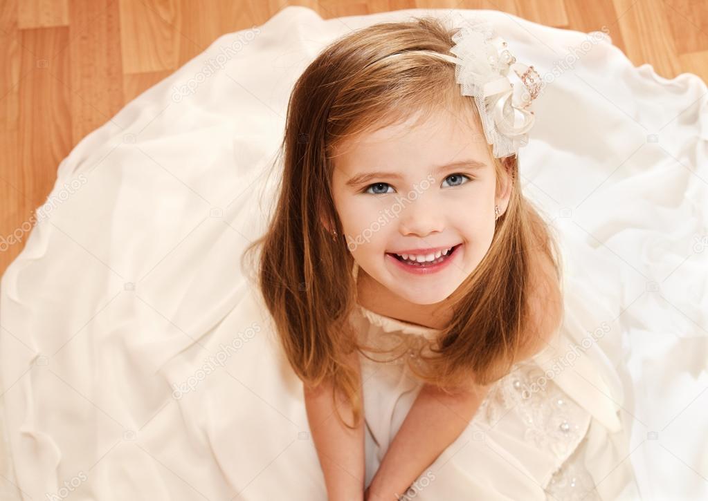Happy adorable little girl in princess dress