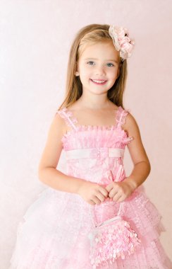 Portrait of adorable smiling little girl in princess dress