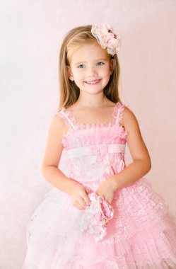 Portrait of adorable smiling little girl in princess dress