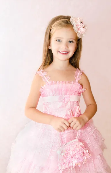 Portrait of adorable smiling little girl in princess dress Stock