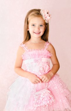 Portrait of adorable smiling little girl in princess dress