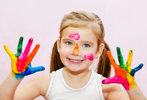 Cute smiling little girl with hands in paint — Stock Photo, Image