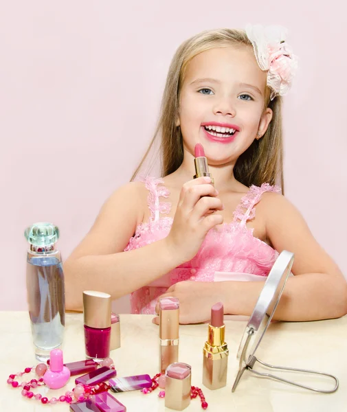 Child cosmetics Cute little girl with lipstick — Stock Photo, Image