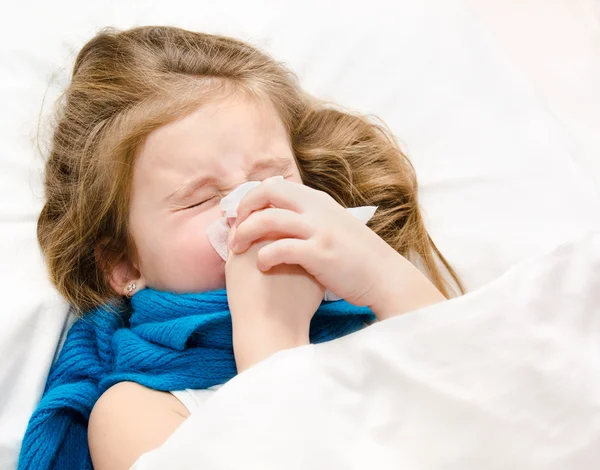 Little girl blowing her nose — Stock Photo, Image